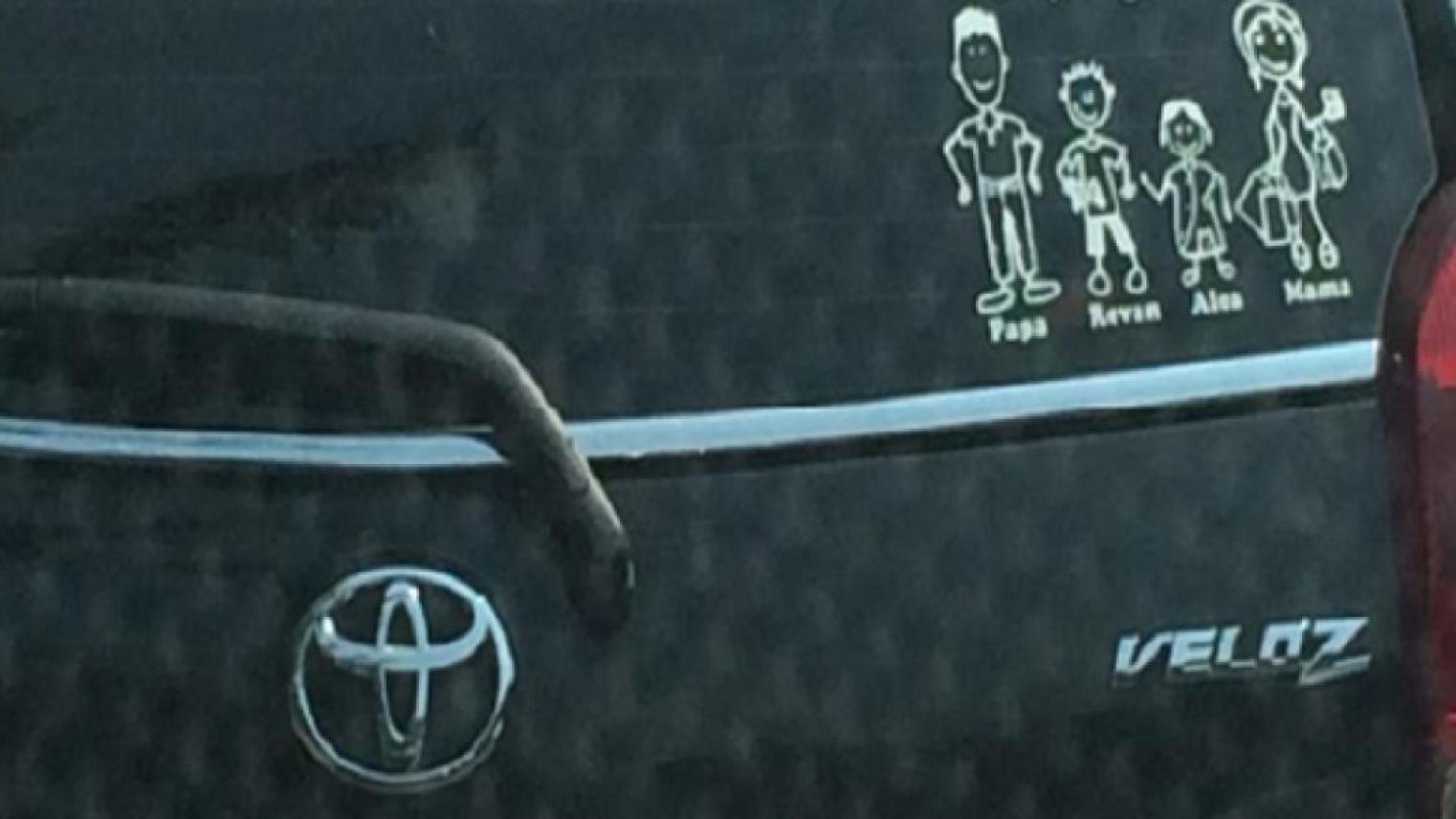 Car back windscreen with family stickers